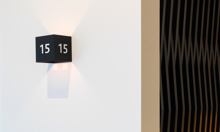 Branding by Neon - Nabarro Law Firm - 125 London Wall Lift Light and room number designed by Dana Robertson