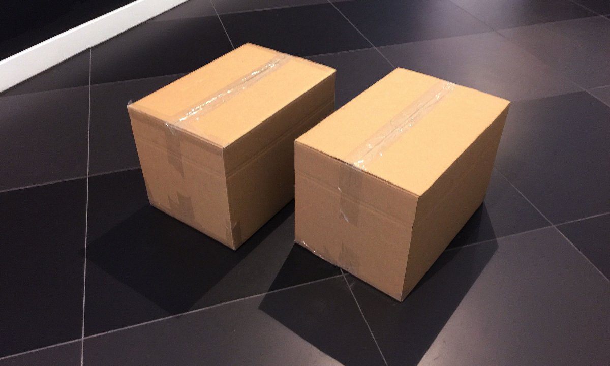 Branding by Neon - designed by Dana Robertson - Nabarro Law Firm - Law sector branding - 125 London Wall - Seasons Greetings Wall - two brown paper boxes hold all the origami wall graphics