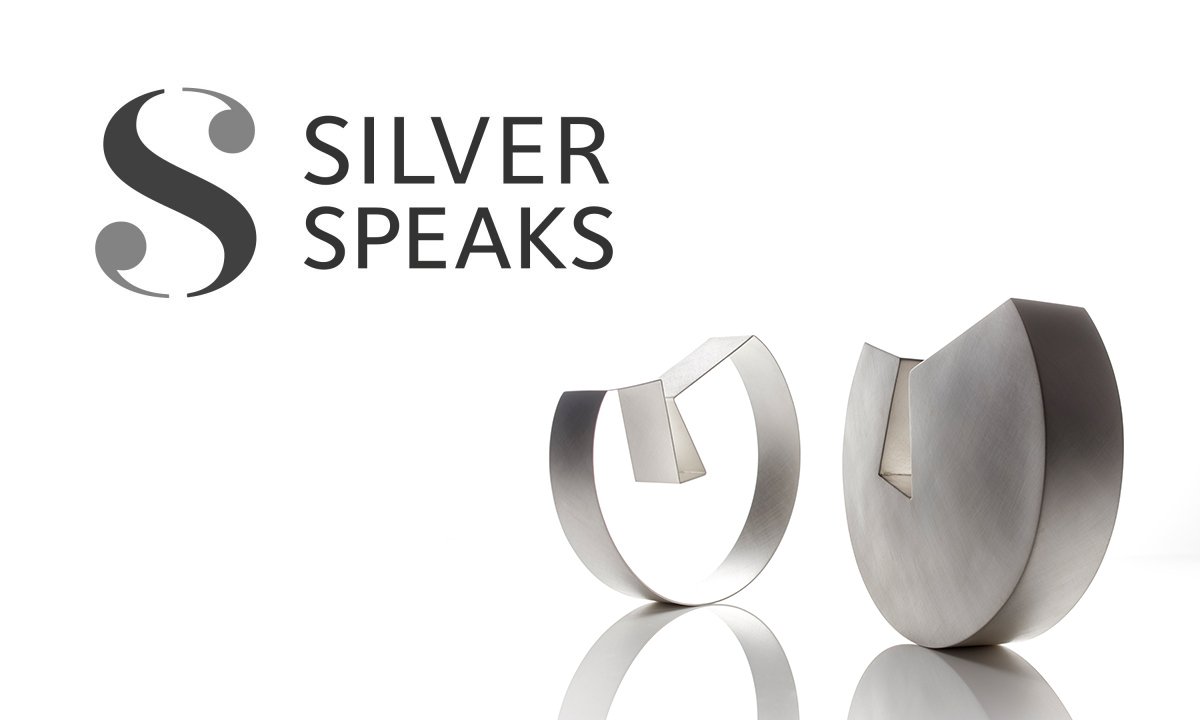 Branding by Neon - designed by Dana Robertson - Silver Speaks exhibition - Silver Speaks logo with silver sculpture