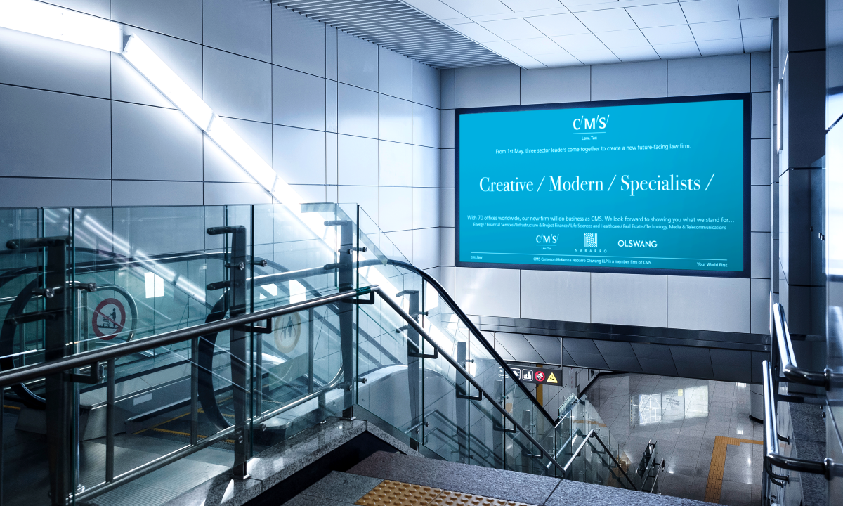 Airport hoarding ad for CMS showcasing the Future Facing Law positioning with 'Creative/Modern/Specialists' slogan, designed by Neon branding agency