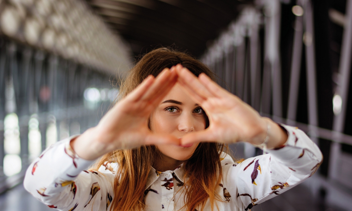 Branding by Neon HW Fisher Chartered Accountants girl making triangle with hands Feature image