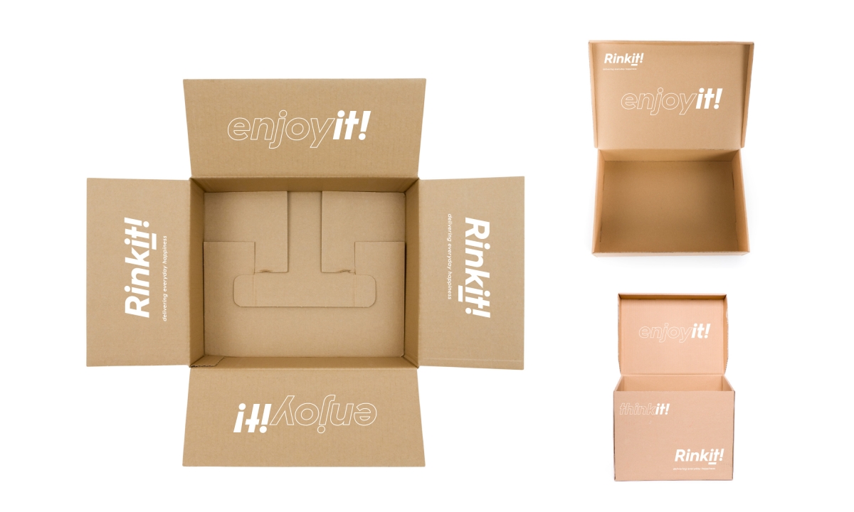 Brown delivery boxes with Rinkit marketing messaging on