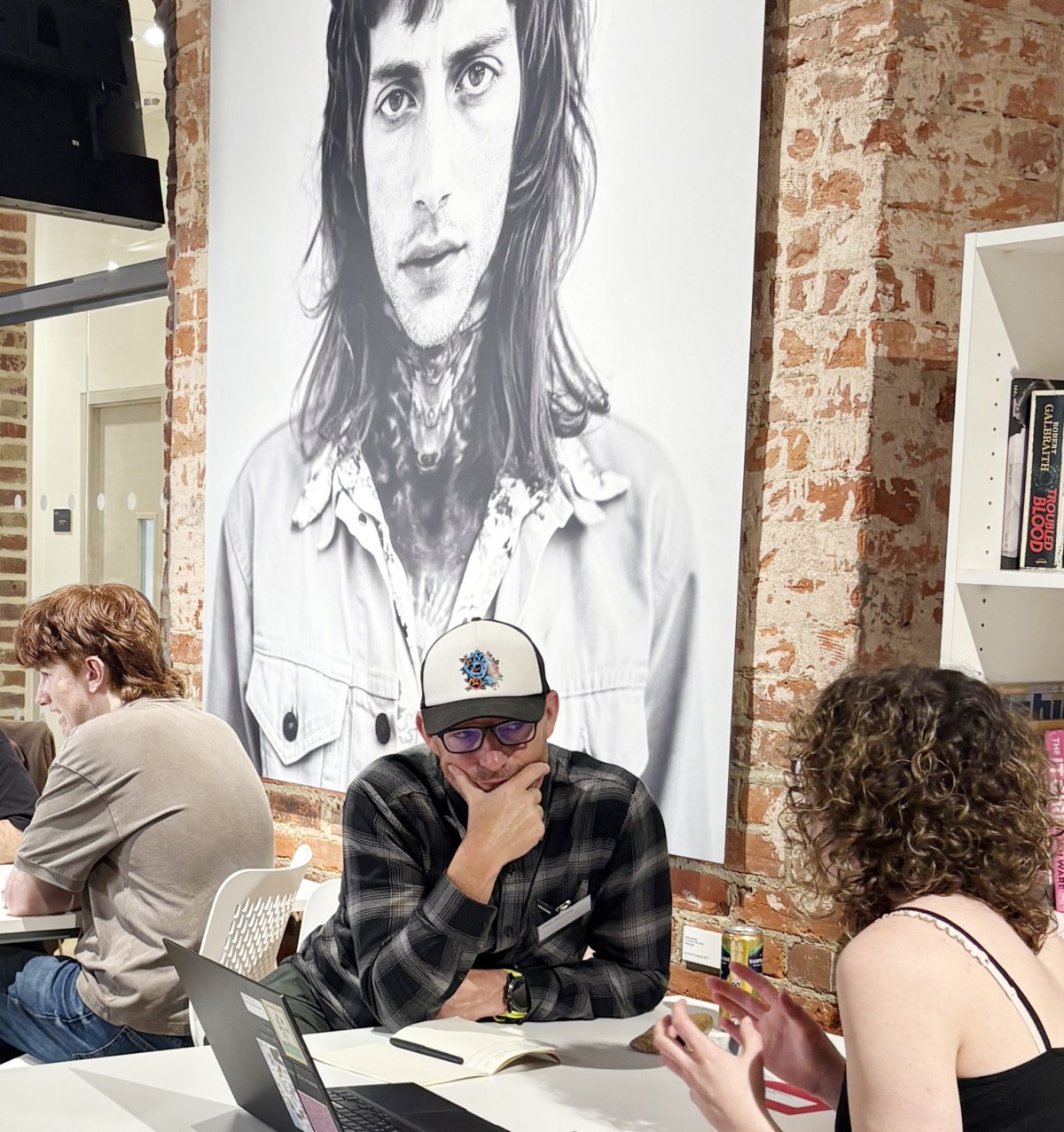 Creative director of Neon Dana Robertson at Norwich University of the Arts Big book crit event in 2026 reviewing a 3rd years student portfolios